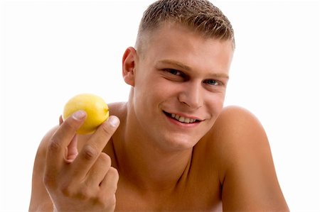 physical fit food - portrait of muscular male with orange on an isolated white background Stock Photo - Budget Royalty-Free & Subscription, Code: 400-05082993