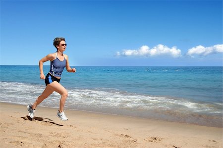 simsearch:400-05025032,k - Young woman running alone on the beach Stock Photo - Budget Royalty-Free & Subscription, Code: 400-05083081