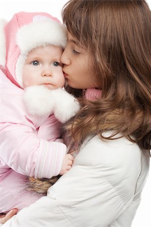 simsearch:400-07088886,k - Elder sister kissing baby girl in winter clothes, isolated Stock Photo - Budget Royalty-Free & Subscription, Code: 400-05083404