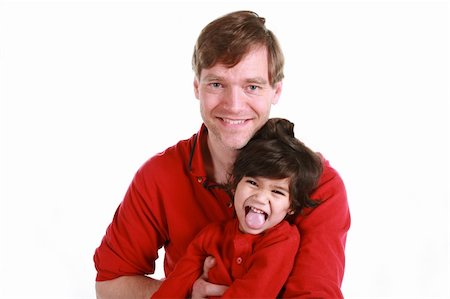 sticking out her tongue - Happy father and son in red shirts isolated on white Foto de stock - Super Valor sin royalties y Suscripción, Código: 400-05083437