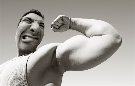 funny photos of biceps - An ugly mean man with big muscles Stock Photo - Budget Royalty-Free & Subscription, Code: 400-05083721