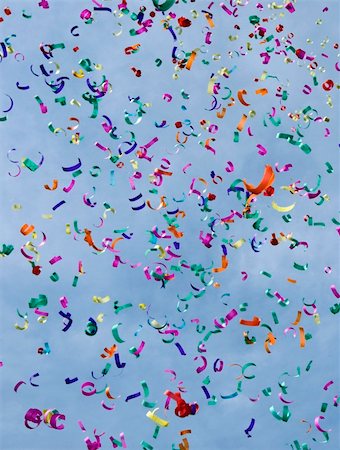 red and yellow confetti - Confetti on the air against blue sky Stock Photo - Budget Royalty-Free & Subscription, Code: 400-05094112