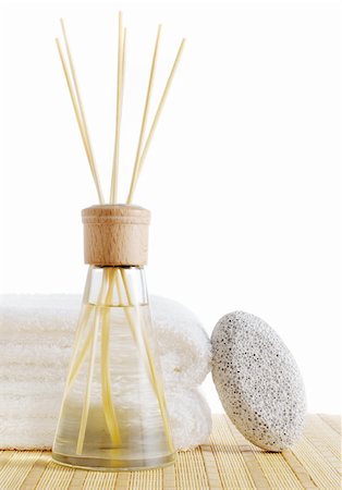 Diffuser, towels, and pumice stone against a white background. Fotografie stock - Microstock e Abbonamento, Codice: 400-05095355