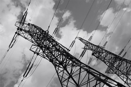 simsearch:400-07055373,k - Electric power line pylones against b&w sky. Fotografie stock - Microstock e Abbonamento, Codice: 400-05095438