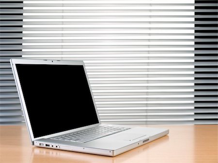 simsearch:400-04641104,k - A laptop on a table at a modern office. Stockbilder - Microstock & Abonnement, Bildnummer: 400-05095505