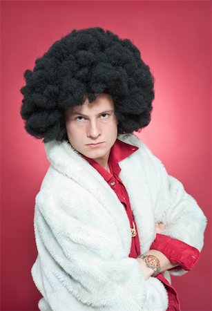 Arrogantly looking man, wearing a wig and a fur coat. Stock Photo - Budget Royalty-Free & Subscription, Code: 400-05095618