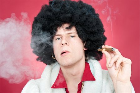 Arrogantly looking man, wearing a wig  and smoking a cigar. Stock Photo - Budget Royalty-Free & Subscription, Code: 400-05095620