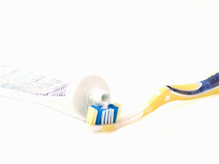 Modern tooth brush and tooth paste isolated on white Stock Photo - Budget Royalty-Free & Subscription, Code: 400-05095674