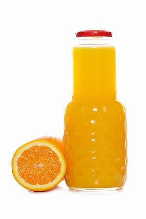 simsearch:689-03124058,k - Orange juice bottle reflected on white background. Shallow depth of field Foto de stock - Super Valor sin royalties y Suscripción, Código: 400-05095835