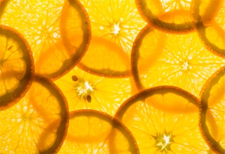 backlit pieces of sliced orange - healthy eating Foto de stock - Super Valor sin royalties y Suscripción, Código: 400-05096485