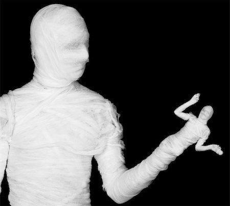 The phantasmagoric mummy - puppeteer on a black background Stock Photo - Budget Royalty-Free & Subscription, Code: 400-05097247