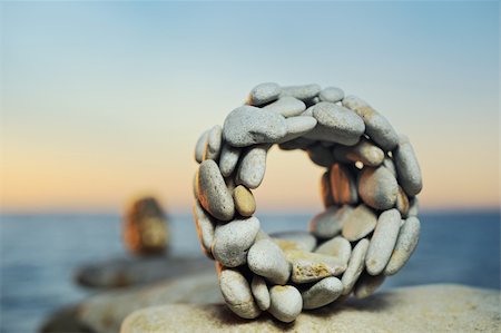 simsearch:400-05138433,k - Sphere from a sea pebble in the summer evening on a beach Stock Photo - Budget Royalty-Free & Subscription, Code: 400-05097660