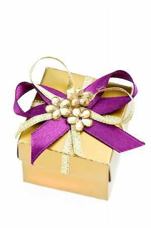 tiny little gift box, isolated on white Foto de stock - Royalty-Free Super Valor e Assinatura, Número: 400-05098071