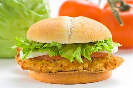 simsearch:400-05098521,k - crisp chicken burger with tomato onion cheese lettuce isolated Foto de stock - Super Valor sin royalties y Suscripción, Código: 400-05098130