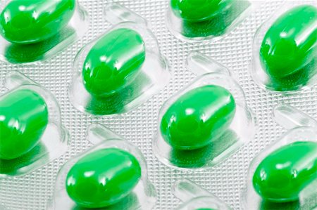 green oval medical pills in their packages Foto de stock - Super Valor sin royalties y Suscripción, Código: 400-05098210