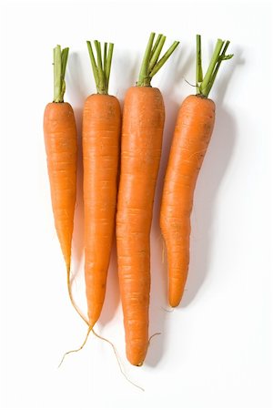 simsearch:622-07743599,k - Bunch of fresh carrots isolated on white background. Clipping path included to remove object shadow or replace background. Foto de stock - Super Valor sin royalties y Suscripción, Código: 400-05098268