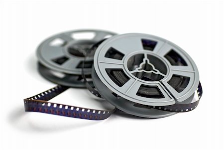 production movie background - still life of 8mm cine film and reels; isolated on white ground; differential focus Stock Photo - Budget Royalty-Free & Subscription, Code: 400-05098307