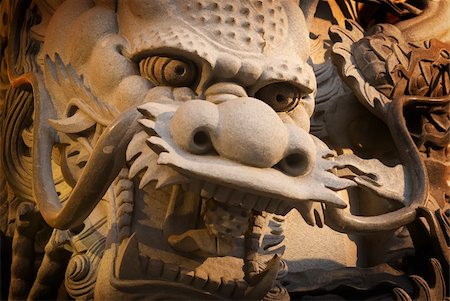 dragon and column - It is a stong carving of Taiwan. The stone dragon was carved in pillars. Stock Photo - Budget Royalty-Free & Subscription, Code: 400-05098469