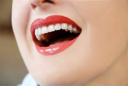 simsearch:400-03954263,k - woman with white teeth and red lips laughing Photographie de stock - Aubaine LD & Abonnement, Code: 400-05098475