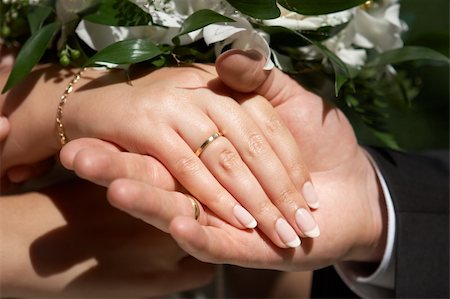 Couple showing there hands with wedding rings Stock Photo - Budget Royalty-Free & Subscription, Code: 400-05098498