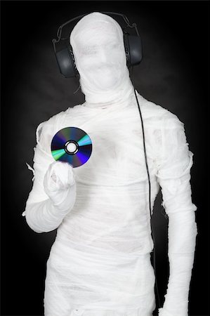 picture of gauze on head - Man in bandage with ear-phones and disc on black Stock Photo - Budget Royalty-Free & Subscription, Code: 400-05099501