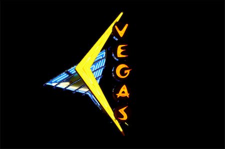 Neon sign with the word "Vegas" over black Foto de stock - Super Valor sin royalties y Suscripción, Código: 400-05099567