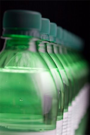 perspective water bottle - Row of green bottles of sparkling water, with shallow depth of field. The second bottle is in focus. Stock Photo - Budget Royalty-Free & Subscription, Code: 400-05090216