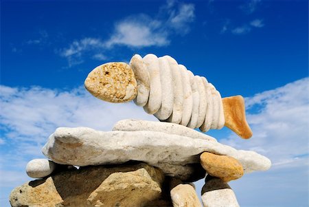 simsearch:400-05138433,k - Pile of sea stones in the form of fish and the dark blue sky Stock Photo - Budget Royalty-Free & Subscription, Code: 400-05090650