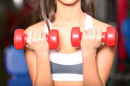 simulator - The girl with dumbbells. Look other photos of this series: Photographie de stock - Aubaine LD & Abonnement, Code: 400-05090788