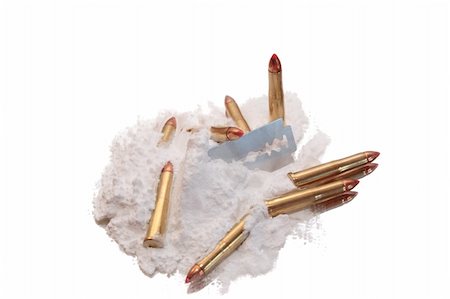 bullets and drugs showing a dangerous side to life against a white background Stock Photo - Budget Royalty-Free & Subscription, Code: 400-05091075