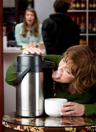 simsearch:400-04554624,k - Woman drinking coffee directly from a beverage dispenser Stock Photo - Budget Royalty-Free & Subscription, Code: 400-05091134