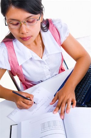 An Asian female scholar is writing mathematics formula. Stock Photo - Budget Royalty-Free & Subscription, Code: 400-05091167