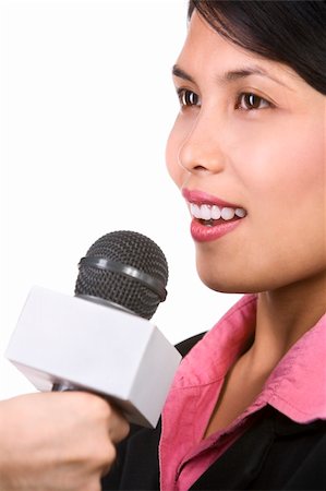 A young businesswoman is being interviewed, shot aginst white background. Focus mainly on woman's mouth Foto de stock - Super Valor sin royalties y Suscripción, Código: 400-05091217