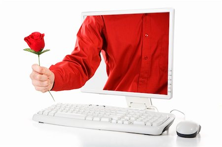 A man is holding a rose came out from computer's screen. Stock Photo - Budget Royalty-Free & Subscription, Code: 400-05091211