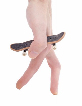 Office entertainment. Fingerboard the reduced copy of a skateboard (isolated) Stock Photo - Budget Royalty-Free & Subscription, Code: 400-05092113