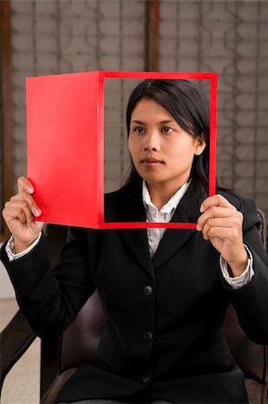 famous people reading - A young businesswoman holding a magazine (look like she reads it) where her face is on cover page. Stock Photo - Budget Royalty-Free & Subscription, Code: 400-05092389