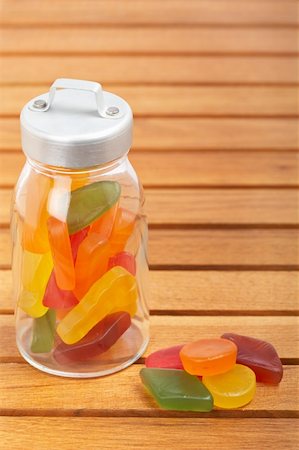 simsearch:400-04781520,k - Colorful candies in the glass jar on wooden background Photographie de stock - Aubaine LD & Abonnement, Code: 400-05092437