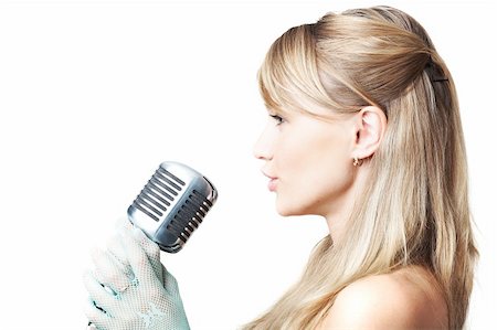 singing woman with retro microphone - Attractive young girl singing, sideview, on white Stock Photo - Budget Royalty-Free & Subscription, Code: 400-05092610