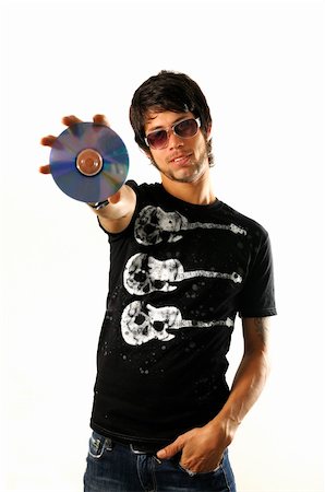 simsearch:400-06795514,k - Portrait of young cool man holding a cd - dvd isolated Photographie de stock - Aubaine LD & Abonnement, Code: 400-05092669