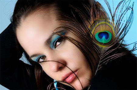 simsearch:400-04070402,k - Portrait of young fashion woman with make up holding peacock feather Stock Photo - Budget Royalty-Free & Subscription, Code: 400-05092692
