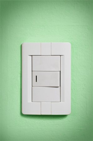 White light switch against a green wall. Stock Photo - Budget Royalty-Free & Subscription, Code: 400-05092700