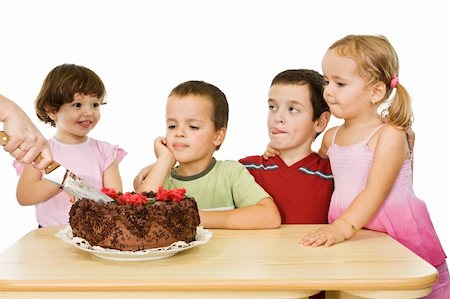 Embracing happy children waiting for the slice of the cake - isolated Stock Photo - Budget Royalty-Free & Subscription, Code: 400-05092771