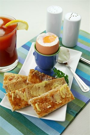 simsearch:400-05255035,k - Breakfast of a boiled egg, toast fingers and fresh icy cold tomato juice. Stock Photo - Budget Royalty-Free & Subscription, Code: 400-05092788