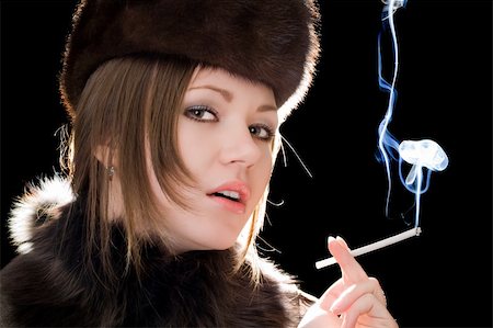 simsearch:400-04631926,k - Portrait of the beautiful young woman with a cigarette Stock Photo - Budget Royalty-Free & Subscription, Code: 400-05092952