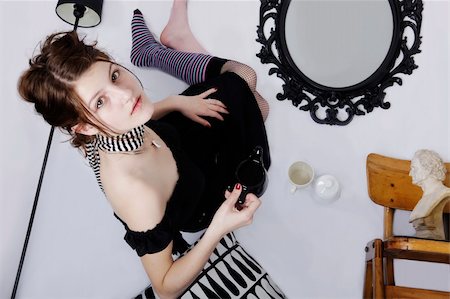 optical illusion about a teen age girl having a tea on a  ceiling Photographie de stock - Aubaine LD & Abonnement, Code: 400-05092995