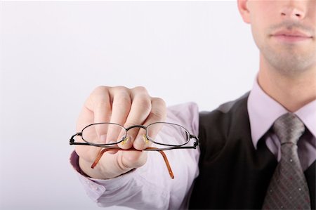 simsearch:400-05381013,k - close up of reading glasses in man's hand Photographie de stock - Aubaine LD & Abonnement, Code: 400-05092999