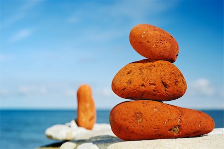 simsearch:625-02927186,k - Three red stones on a beach in the morning in the summer Photographie de stock - Aubaine LD & Abonnement, Code: 400-05093242
