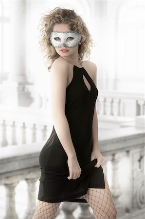 simsearch:400-07981805,k - pretty young woman in elegant black dress white mask and fishnet stockings Stock Photo - Budget Royalty-Free & Subscription, Code: 400-05093420