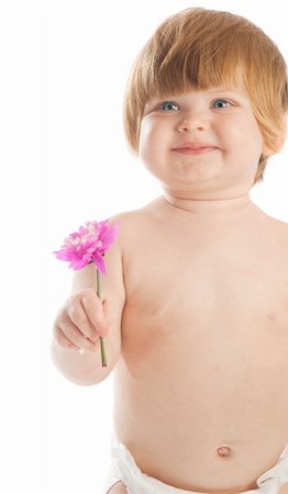 simsearch:400-05130009,k - Red-haired baby holding or giving a flower Stock Photo - Budget Royalty-Free & Subscription, Code: 400-05093842