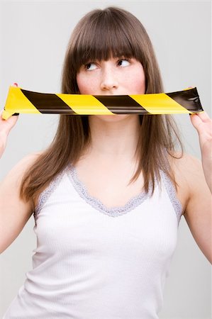 Portrait of young woman with taped mouth Foto de stock - Royalty-Free Super Valor e Assinatura, Número: 400-05104165
